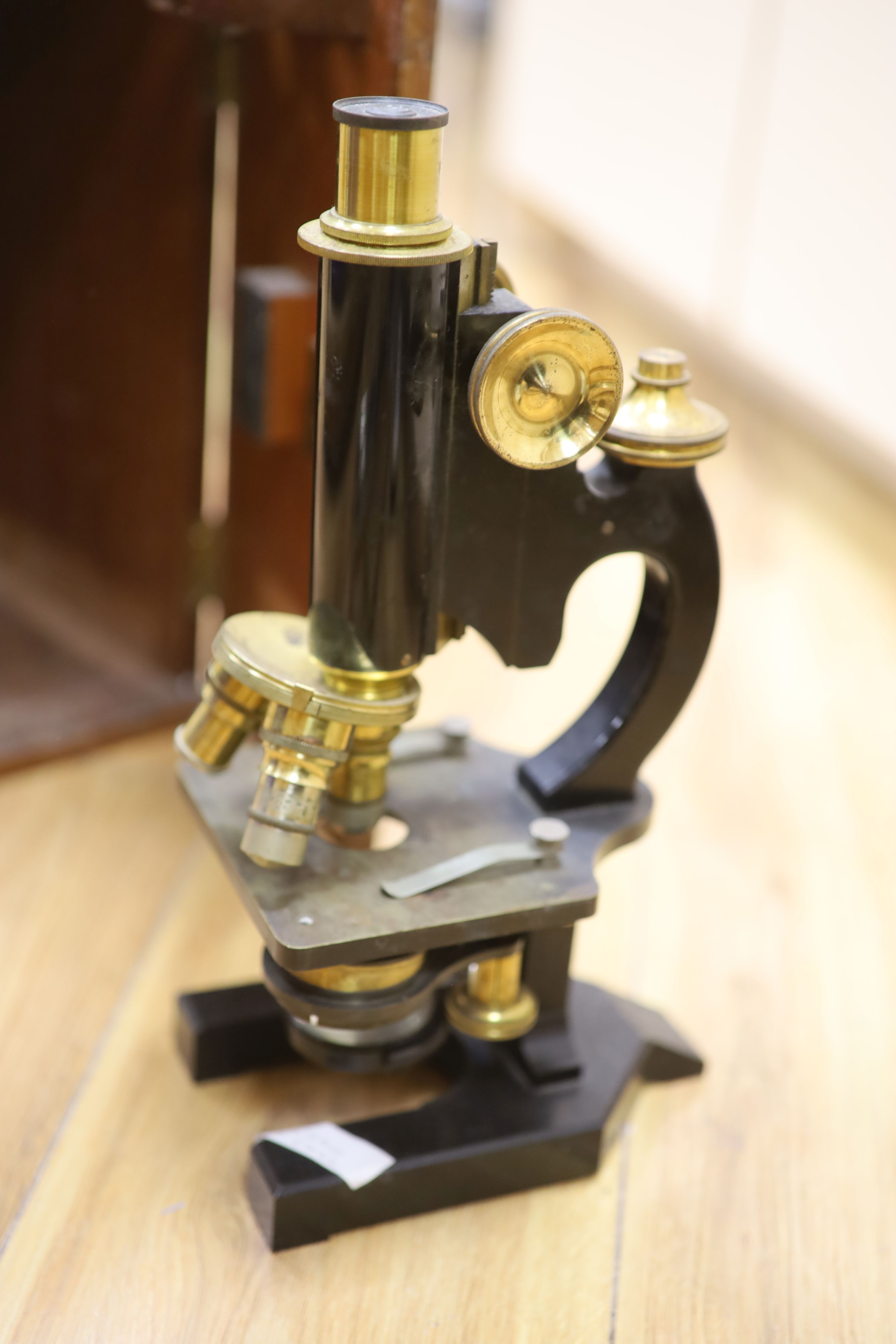 A mahogany cased microscope and veterinary equipment